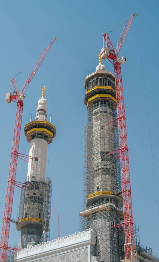 A couple of tall buildings under a blue sky
