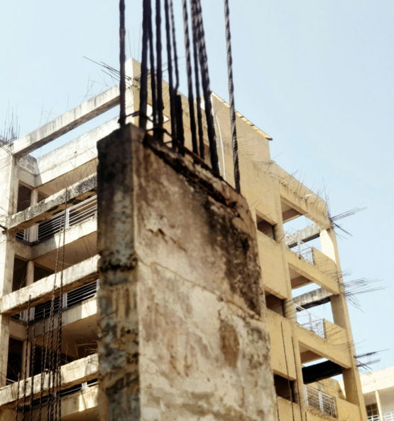 a very tall building with a bunch of wires on top of it