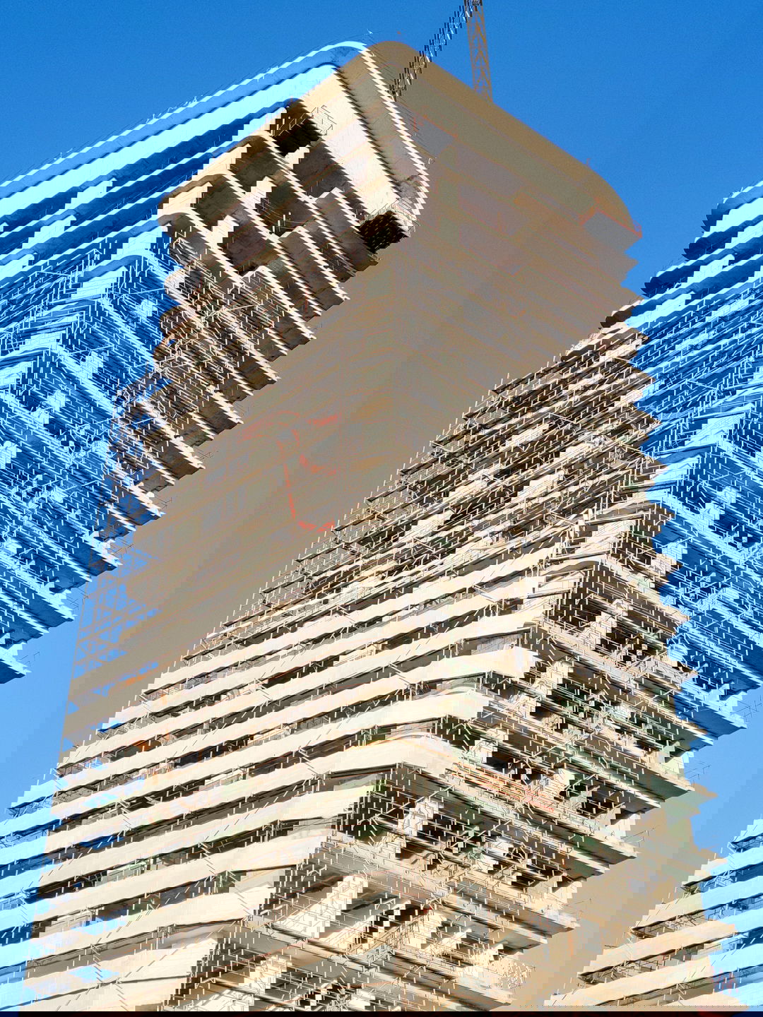 a tall building with scaffolding on the side of it